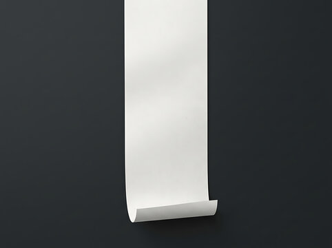 Long white paper roll hanging on a dark gray wall