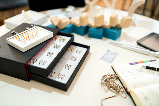 Jewelry collection displaying artisan wedding rings and custom size sizer tools