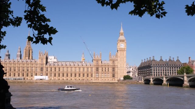 London, UK - July 11, 2022: Big Ben and the fountains Revolving Torsion, in Gabo Fountain Garden at St Thomas' Hospital in London