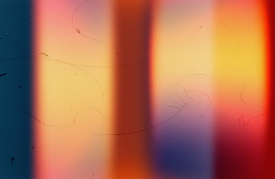 Vintage 35mm film burn streak texture overlay.Professional cinematic film overlay background.Old school film burn rainbow overlay texture for retro poster design.