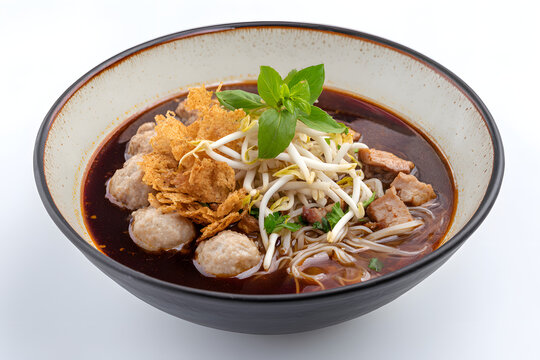 Delicious Boat Noodles in a Bowl with Crispy Toppings and Fresh Ingredients