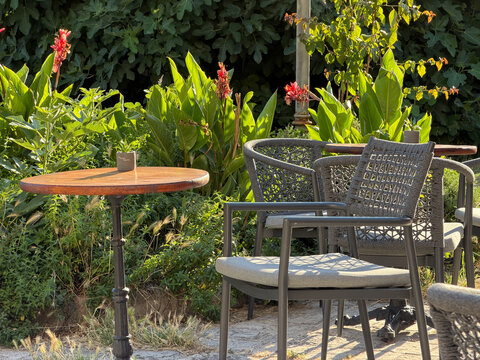 Small table at an outdoor summer cafe with relaxed atmosphere, urban dining and vacation lifestyle concept