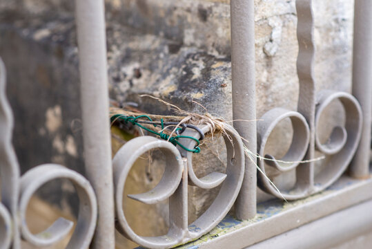 Broken Metal Railing Repaired with Wire and Twine