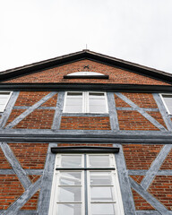 Fototapeta premium Low angle view of historic timber framed building facade