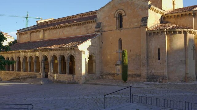 Romanesque church with arcaded portico in the historic center of Segovia Spain during golden afternoon light
