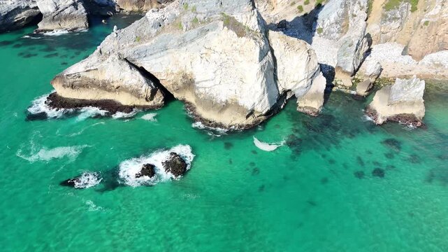 Drone Orbit Around Praia da Ursa Sea Stack with Crashing Atlantic Waves