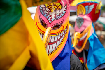 Fototapeta premium Phi Ta Khon is the name of performance in which performers wear scary and ugly but colorful masks, and colorful cloth costumes, and parade in a fun procession. It is festival of Loei Province,Thailand