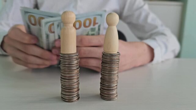 Building stacks of coins while handling cash at a table
