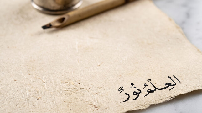 Traditional Reed Pen and Parchment with Copy Space. Islamic Scholarship and Mawlid Concept