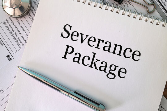Severance Package text on notebook with pen and paperclips on white background, employment law and HR concept