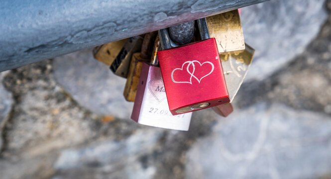 Red love padlock with interlocking hearts symbolizing eternal commitment