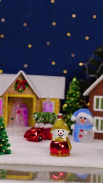 A large Christmas town with cars, houses, snowmen and Christmas trees