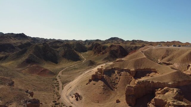 Video of a flight over numerous hills. Drone footage of a flight over hills.