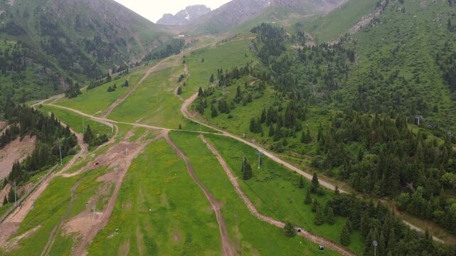 Green mountains with a funicular. Drone footage of a funicular in the green mountains.