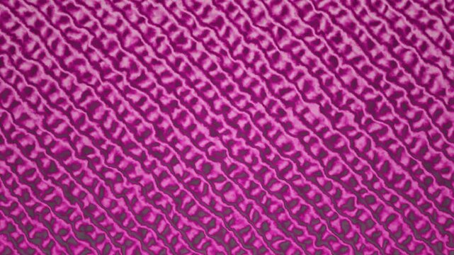 Purple seamless background with diagonal texture pattern