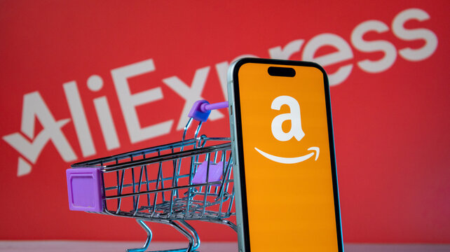 Amazon app icon on smartphone with AliExpress brand background and cart.