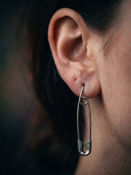 Profile View of Woman Ear Wearing Safety Pin as Earring Jewelry