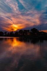Fototapeta premium Summer sunset or sundowner view with reflections near Plattling, Isar, Deggendorf, Bavaria, Germany