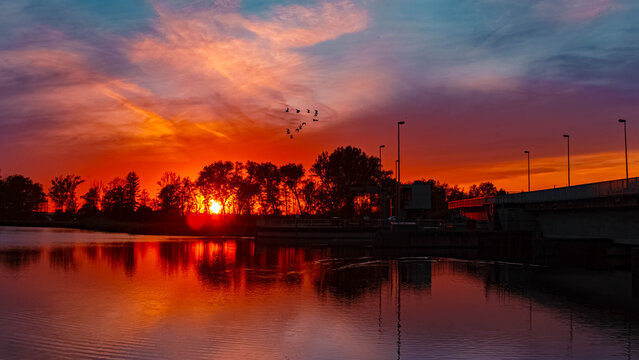 Summer sunset or sundowner view with reflections near Plattling, Isar, Deggendorf, Bavaria, Germany