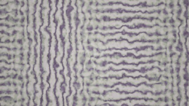 An abstract purple and white wavy texture creates a seamless looping background pattern.