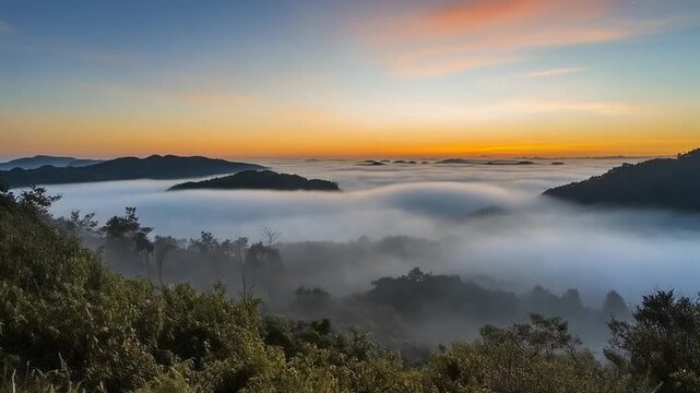 Hilltop mist timelapse swirling fog continuously light revealing beautiful terrain across valley