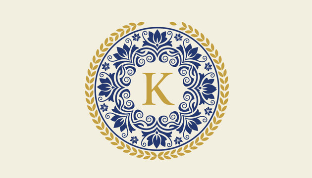Luxury monogram template featuring capital letter K surrounded by blue floral mandala and a gold laurel wreath.