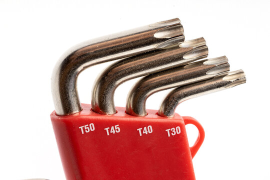 Set of hexagonal wrenches in a red box for work isolated on white background.