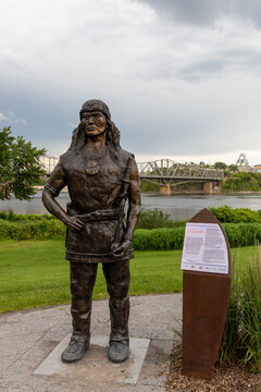 Gatineau, Canada - June 20, 2026: Bronze statue of Algonquin Chief Tessouat near Canadian Museum of History. Historic Indigenous chief monument overlooking Ottawa River and Alexandra Bridge