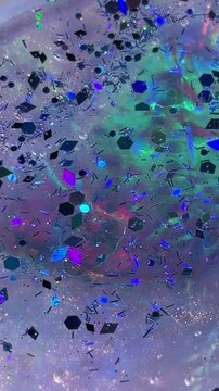 Glitter background with iridescent particles