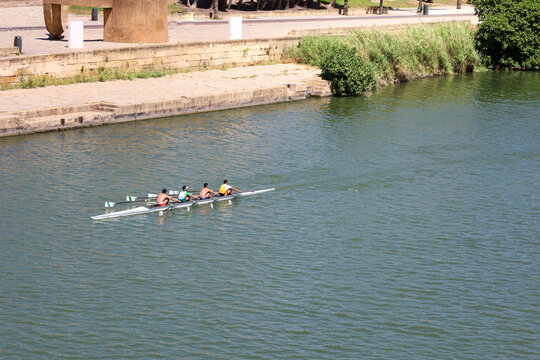 People canoeing on the Guadalquivir River in Seville city