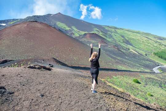 Joyful Woman with Arms Outstretched on Mount Etna
