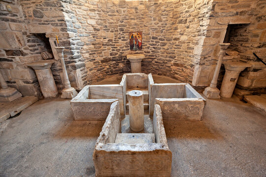Early Christian baptistery at the monastery of Katapoliani, in Paros island, Greece, Europe. It is cross-shaped and marble maid, a rare monument of the 4th c. BC.  