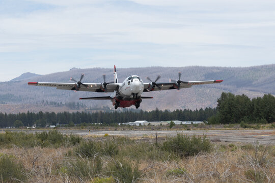 CHESTER, CALIFORNIA - JULY 19, 2026: Coulson C-130 Hercules air tanker Tanker 140 lifts off from Rogers Field heading to fight the Biscar Fire.