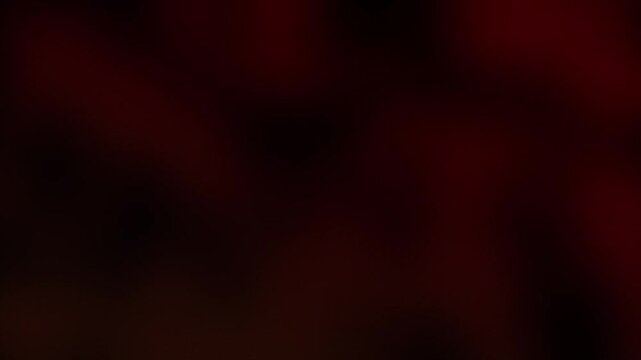 Abstract dark orange blurred smoky background with warm ambient motion loop