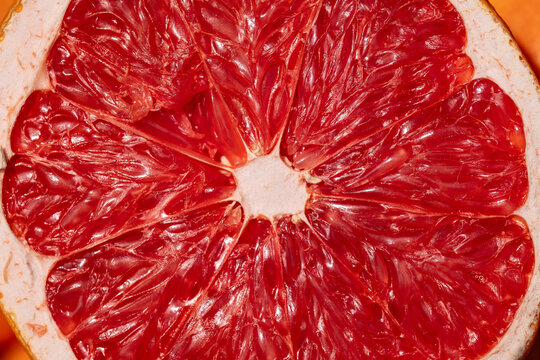 Red grapefruit pulp texture fresh juicy close up