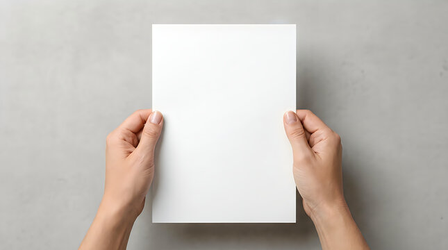 Hands holding a blank white a4 paper sheet for document mockup and design template