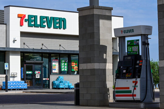 7-Eleven convenience store and fuel pump at a modern gas station, representing convenience retail, fuel services, and roadside commerce