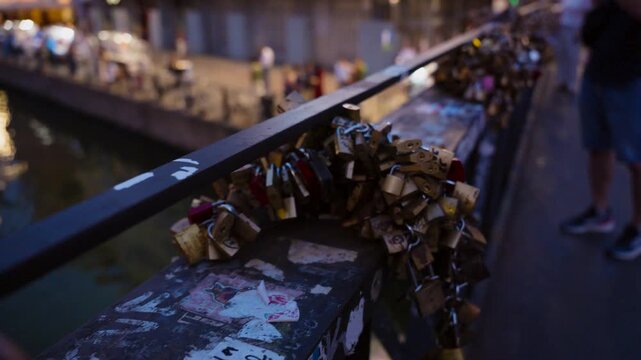 Love padlocks on a bridge in Navigli canals, Milan