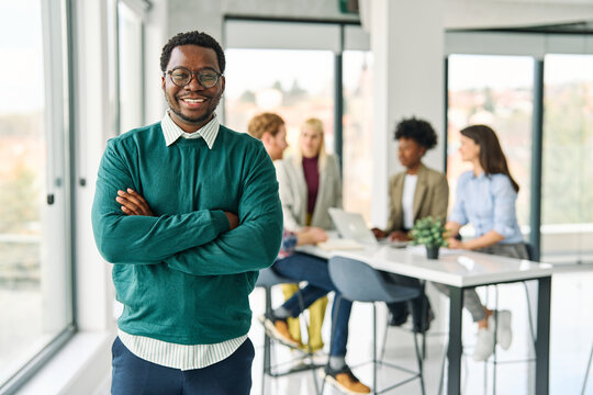 Portrait of a group of young business people having a meeting or training in the office. Teamwork and success concept, portrait of a smart young businessman, student, teacher or coach