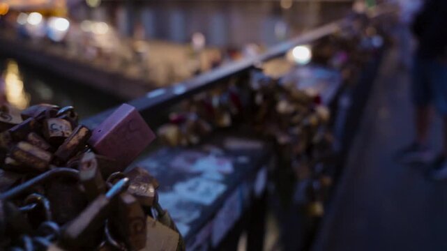 Love padlocks on a bridge in Milan Italy