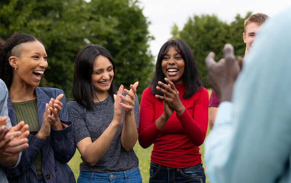 Close-up of Diverse Women Friends Laughing and Clapping Outdoors