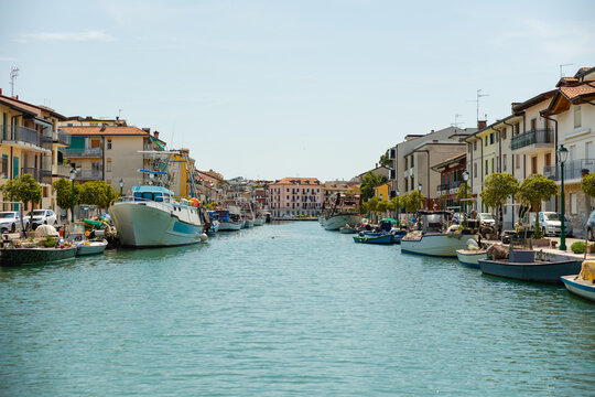 View of Mandracchio fishing harbor Grado Friuli Venezia Giulia Italy colorful houses boats canal
