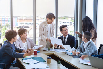 Fototapeta premium Successful happy workers Group of business people with Multiethnic workers with in company workers Group of asian business people and support Teamwork in the meeting room at modern office.