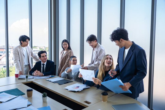 Successful happy workers Group of business people with Multiethnic workers with in company workers Group of asian business people and support Teamwork in the meeting room at modern office.