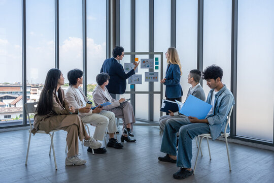 Successful happy workers Group of business people with Multiethnic workers with in company workers Group of asian business people and support Teamwork in the meeting room at modern office.