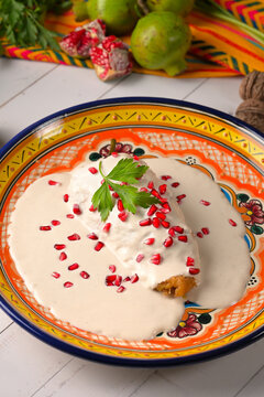Delicious Mexican Gastronomy. Stuffed Chili Pepper in Walnut Sauce. Chile en Nogada