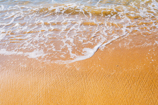 White Sea Foam Wave on Yellow Sandy Beach &mdash; Summer Coastal Background