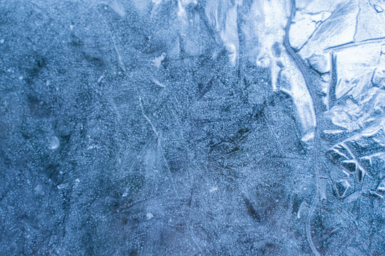 Abstract Blue Ice Texture Background with Frost Patterns in Winter