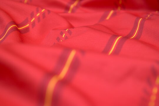 Athletic shirt texture for a Spanish national team style jersey with bold striped details and a professional finish.