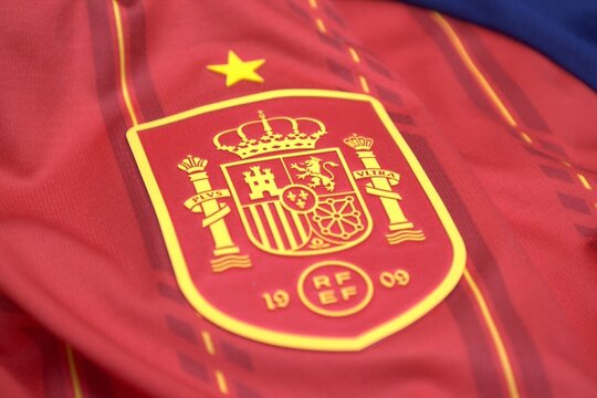 Spain football jersey texture with the official crest and RFEF emblem, featuring a bold red sporty design.